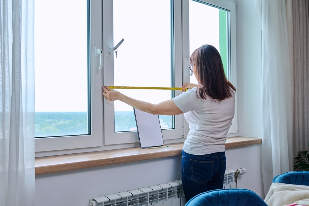 Woman,Measuring,Window,With,Tape,Measure,,Tailoring,Service